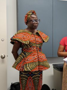 Dr. Philomina Okeke-Ihejirika standing giving a speech.